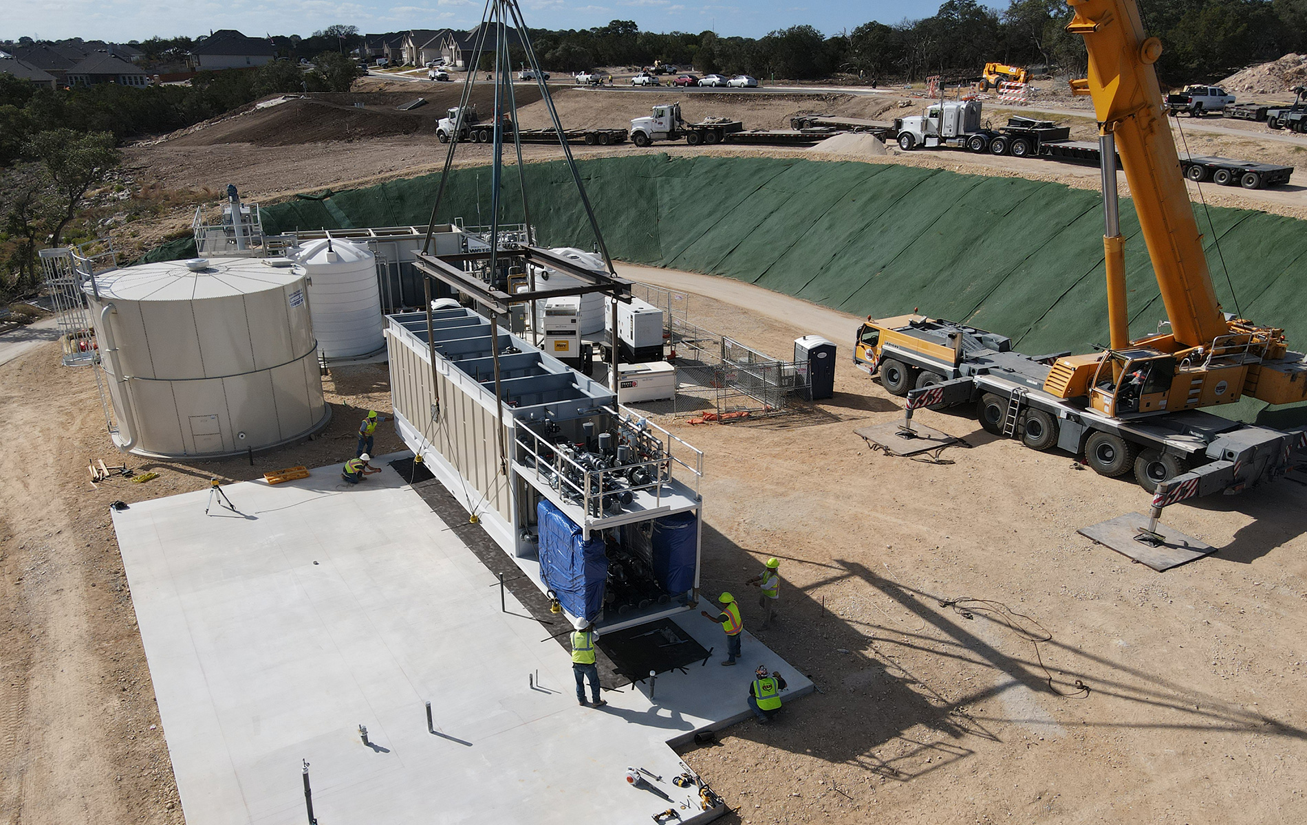 Blubox MBR unit being moved into position by a construction crane | Veyra | scalable wastewater solutions